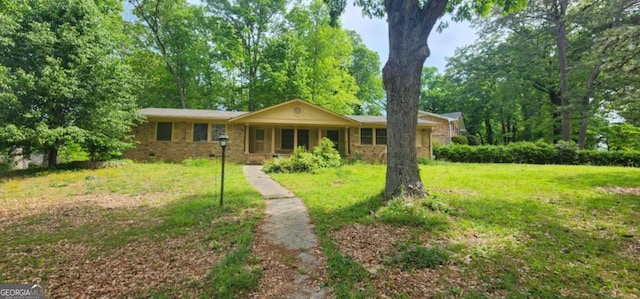 ranch-style home with a porch and a front yard
