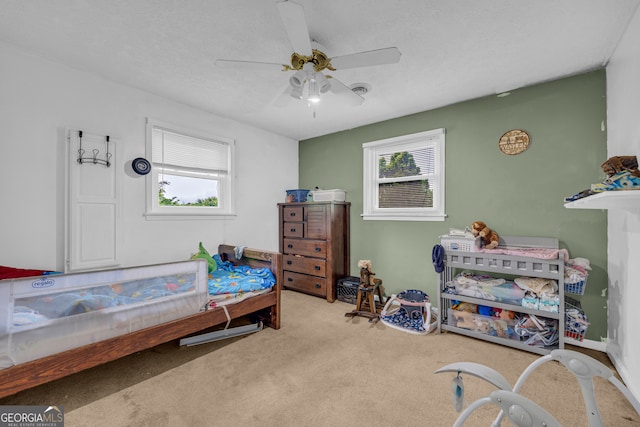 carpeted bedroom with a ceiling fan