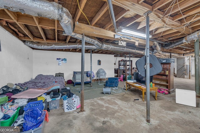unfinished basement with concrete block wall