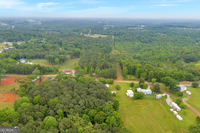 drone / aerial view featuring a forest view