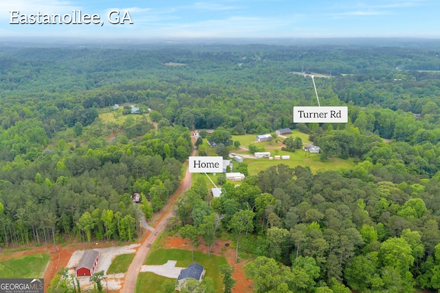 bird's eye view with a view of trees