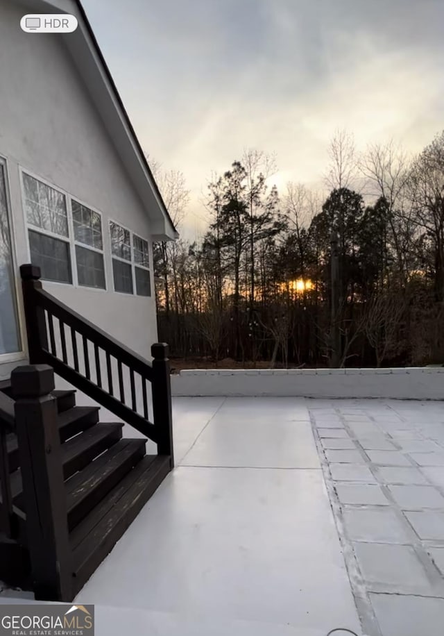 view of patio terrace at dusk