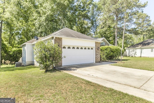 view of property exterior with central air condition unit, brick siding, a yard, concrete driveway, and a garage