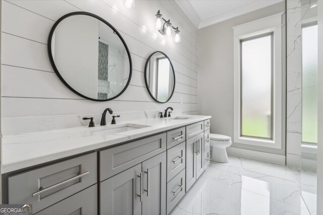 852 Tom Miller Rd, Bethlehem, GA 30620 - bathroom featuring double vanity, toilet, a sink, plenty of natural light, and marble finish floor