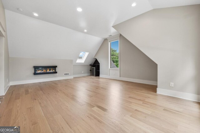 852 Tom Miller Rd, Bethlehem, GA 30620 - bonus room with lofted ceiling, recessed lighting, visible vents, and light wood-style floors