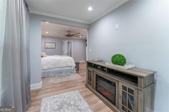 bedroom featuring baseboards, recessed lighting, and crown molding
