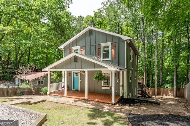 view of outbuilding with fence and stairs