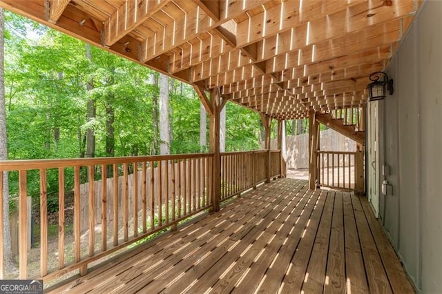 wooden terrace featuring stairs
