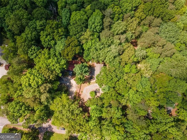bird's eye view featuring a forest view