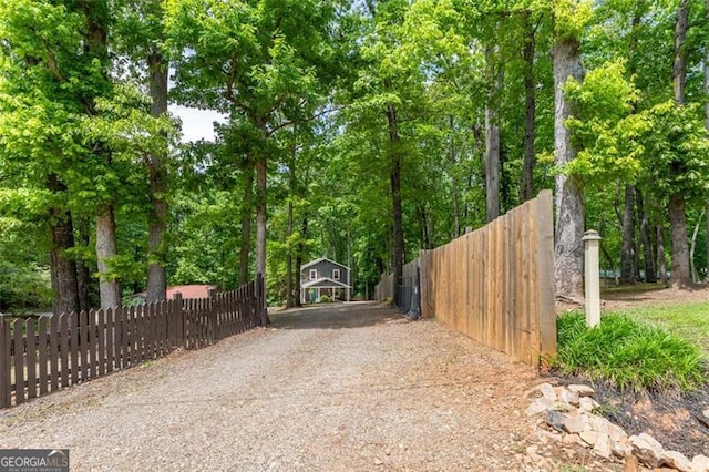 view of gate featuring fence