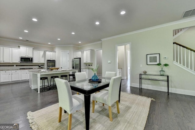 dining room featuring dark wood-style flooring, stairs, recessed lighting, ornamental molding, and baseboards