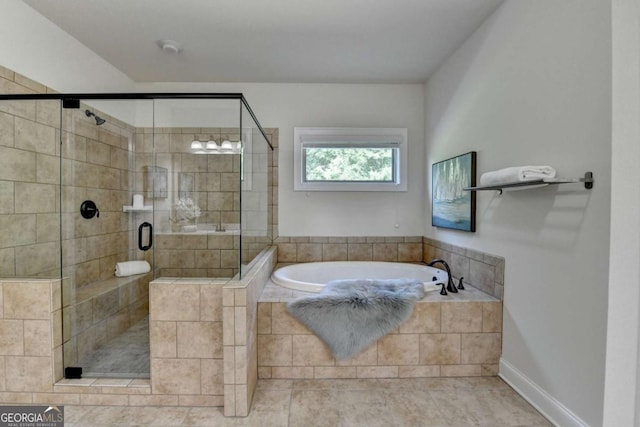 full bathroom featuring a garden tub, a shower stall, and baseboards