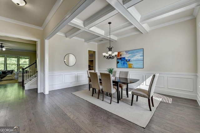 dining room featuring beamed ceiling, stairs, dark wood-type flooring, a chandelier, and a decorative wall