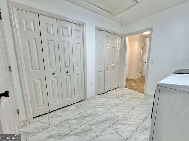801 W Grossman Dr, Vidalia, GA 30474 - bedroom featuring attic access, washer and clothes dryer, multiple closets, and light marble finish floors