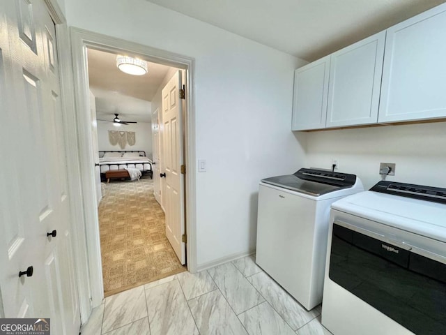 801 W Grossman Dr, Vidalia, GA 30474 - laundry area featuring cabinet space, washer and clothes dryer, light marble finish floors, and baseboards