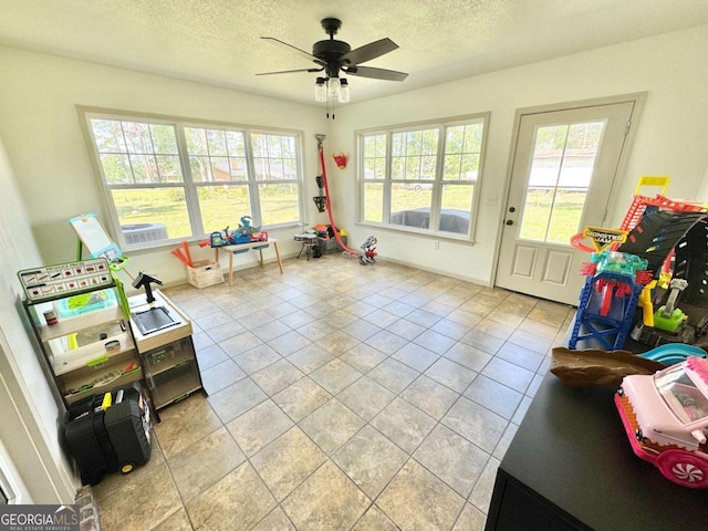 801 W Grossman Dr, Vidalia, GA 30474 - game room with a textured ceiling, a ceiling fan, and light tile patterned flooring