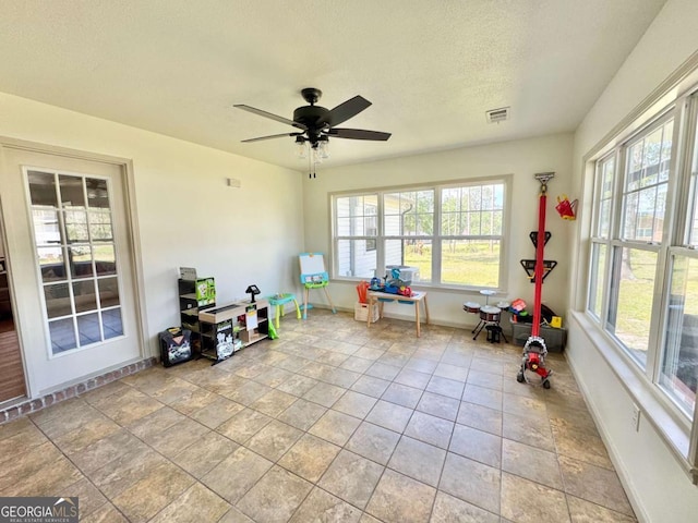 801 W Grossman Dr, Vidalia, GA 30474 - sunroom featuring healthy amount of natural light, baseboards, and a textured ceiling