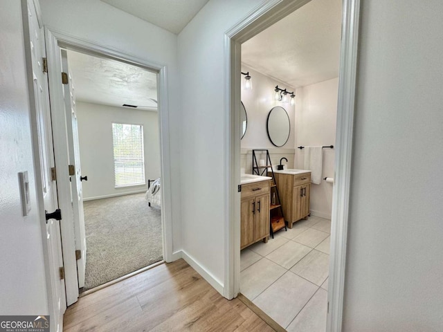 801 W Grossman Dr, Vidalia, GA 30474 - bathroom featuring vanity, baseboards, and wood finished floors