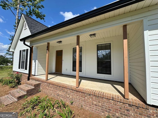 801 W Grossman Dr, Vidalia, GA 30474 - entrance to property featuring roof with shingles and covered porch
