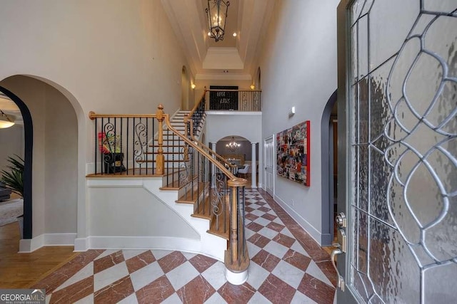 3127 Lenox Rd NE Unit 1, Atlanta, GA 30324 - entryway with stairway, ornamental molding, arched walkways, and baseboards