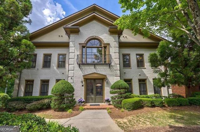 3127 Lenox Rd NE Unit 1, Atlanta, GA 30324 - view of front of property with brick siding and a balcony