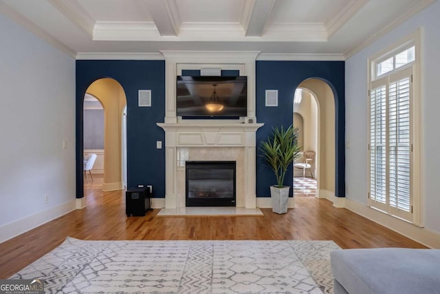 3127 Lenox Rd NE Unit 1, Atlanta, GA 30324 - living room featuring crown molding, wood finished floors, arched walkways, and a high end fireplace