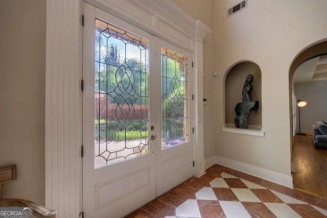 3127 Lenox Rd NE Unit 1, Atlanta, GA 30324 - entryway with arched walkways, french doors, visible vents, and plenty of natural light