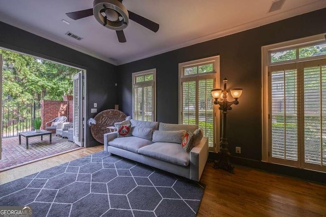 3127 Lenox Rd NE Unit 1, Atlanta, GA 30324 - living area featuring a ceiling fan, crown molding, visible vents, and wood finished floors
