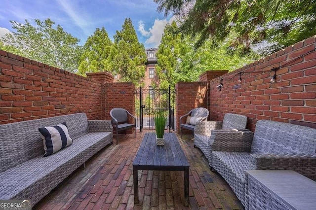 3127 Lenox Rd NE Unit 1, Atlanta, GA 30324 - view of patio / terrace featuring a gate, an outdoor hangout area, and fence