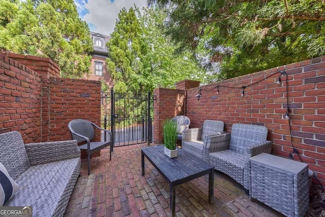 3127 Lenox Rd NE Unit 1, Atlanta, GA 30324 - view of patio / terrace featuring fence and a gate