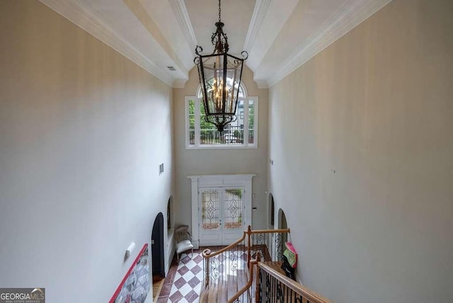 3127 Lenox Rd NE Unit 1, Atlanta, GA 30324 - entryway featuring crown molding, a chandelier, and a high ceiling