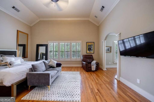 3127 Lenox Rd NE Unit 1, Atlanta, GA 30324 - bedroom with arched walkways, light wood finished floors, visible vents, and ornate columns