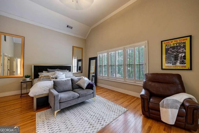 3127 Lenox Rd NE Unit 1, Atlanta, GA 30324 - bedroom featuring high vaulted ceiling, light wood-type flooring, visible vents, crown molding, and baseboards