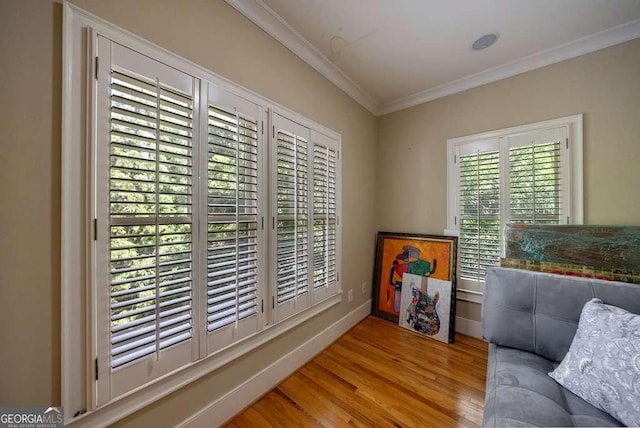 3127 Lenox Rd NE Unit 1, Atlanta, GA 30324 - living area featuring baseboards, crown molding, and wood finished floors