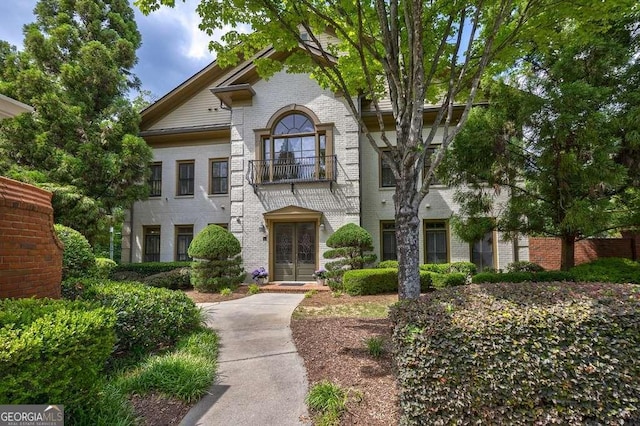 3127 Lenox Rd NE Unit 1, Atlanta, GA 30324 - view of front of house featuring a balcony, french doors, and brick siding