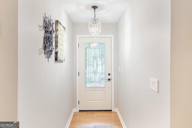 1605 Barrier Rd, Marietta, GA 30066 - entryway featuring a chandelier, light wood finished floors, and baseboards