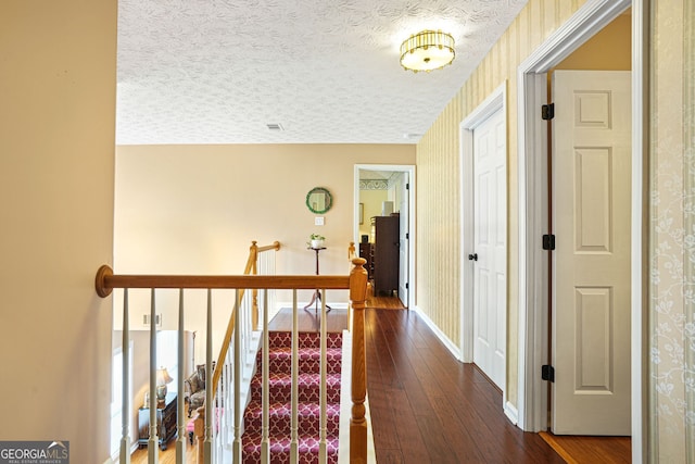5070 Saddle Bridge Ln, Alpharetta, GA 30022 - hall featuring dark wood-style flooring, wallpapered walls, and baseboards