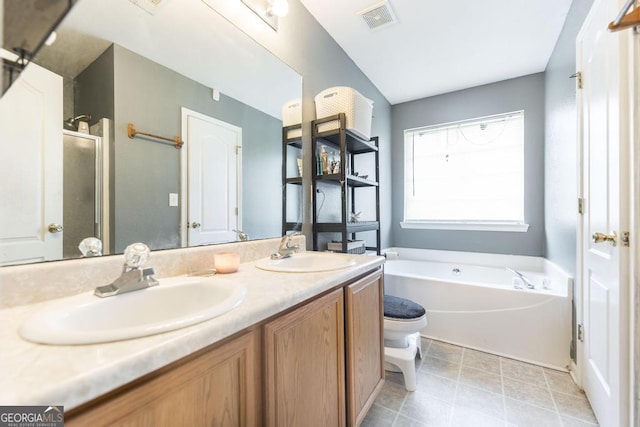 full bathroom with a garden tub, visible vents, a sink, and double vanity