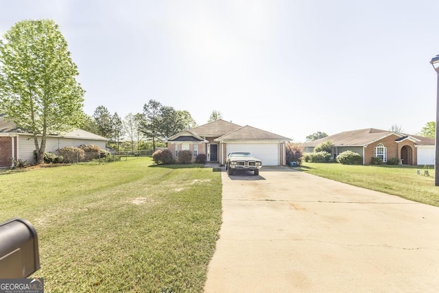 single story home featuring concrete driveway, a front yard, and an attached garage
