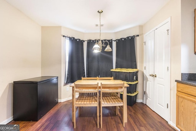 dining space featuring baseboards, visible vents, and dark wood-type flooring
