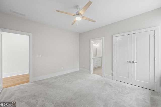 1301 Grayson Pointe Dr, Buckhead, GA 30625 - unfurnished bedroom featuring carpet floors, baseboards, ensuite bathroom, a closet, and a ceiling fan
