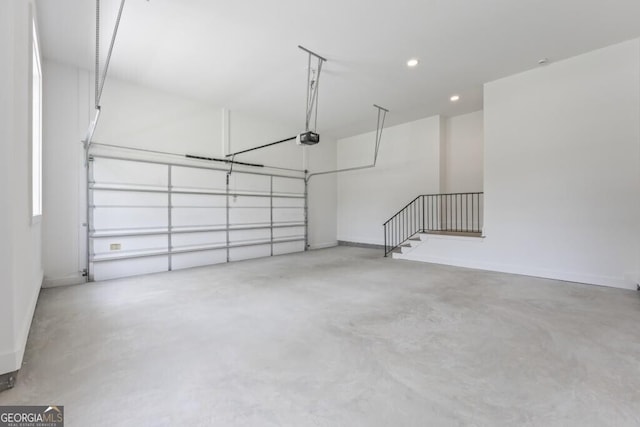 1301 Grayson Pointe Dr, Buckhead, GA 30625 - garage featuring a garage door opener, recessed lighting, and baseboards
