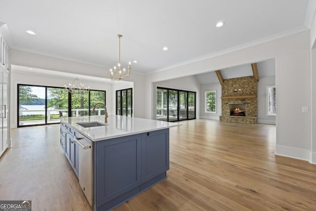 1301 Grayson Pointe Dr, Buckhead, GA 30625 - kitchen with a sink, a chandelier, plenty of natural light, open floor plan, and ornamental molding