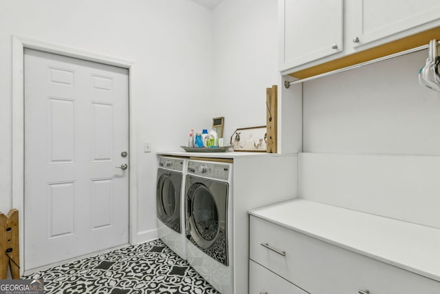 laundry room with washer and clothes dryer, cabinet space, baseboards, and tile patterned floors