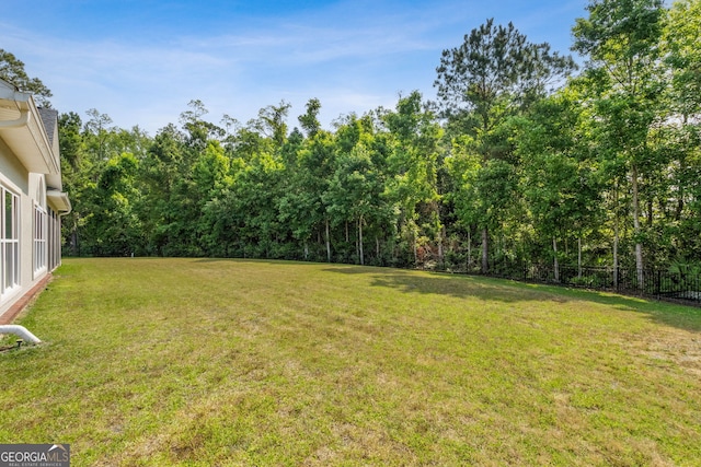 view of yard with a forest view