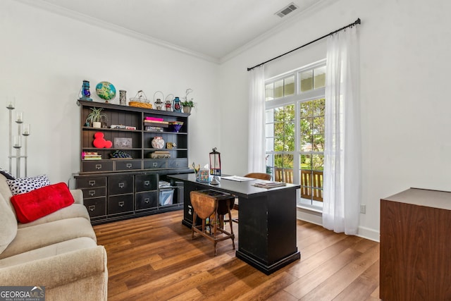 office area featuring ornamental molding, wood finished floors, and baseboards