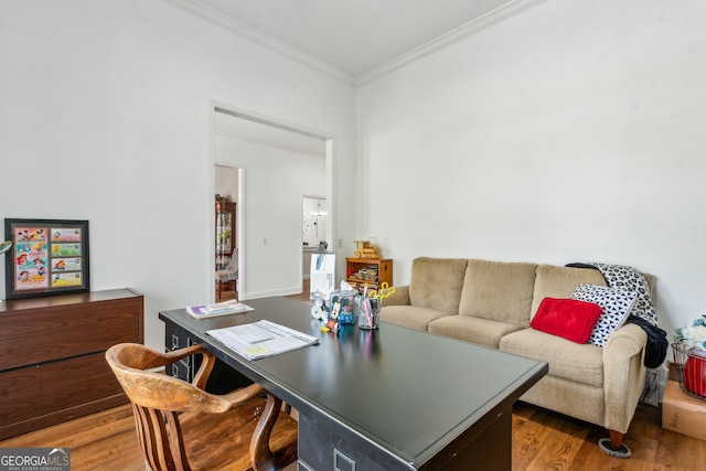 office space with crown molding and wood finished floors