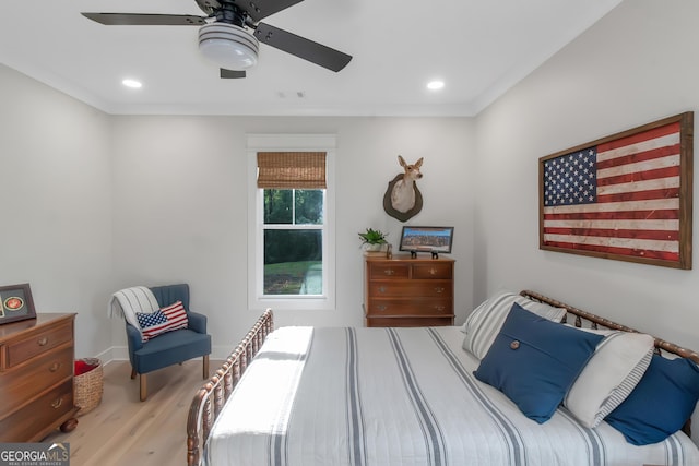 bedroom featuring ornamental molding, recessed lighting, visible vents, and wood finished floors
