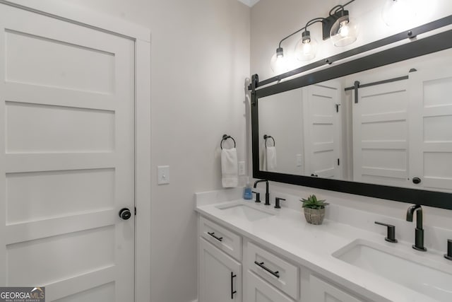 bathroom with double vanity and a sink