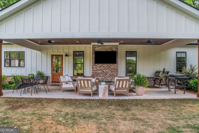 back of house with a yard, a ceiling fan, and board and batten siding